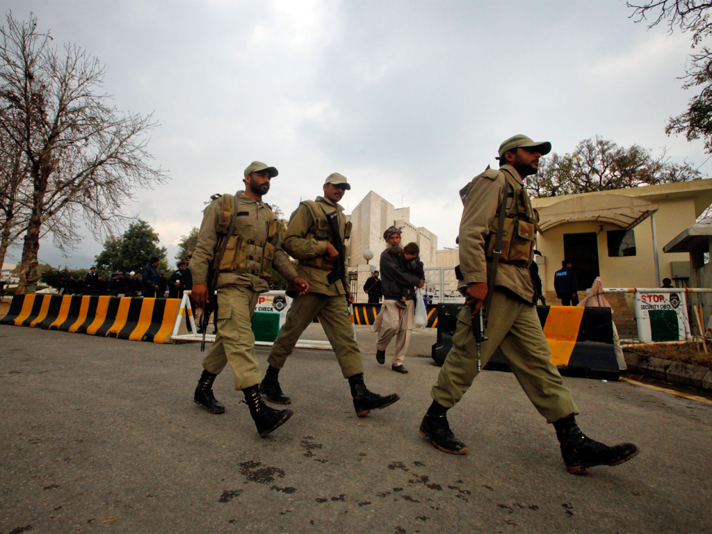 Security personnel monitoring a road during the indefinite curfew in Khad Kocha, Mastung district.