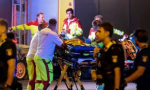 Emergency responders and police at the scene after a car crashed into a crowd during Berlin's LGBTQ Pride parade.