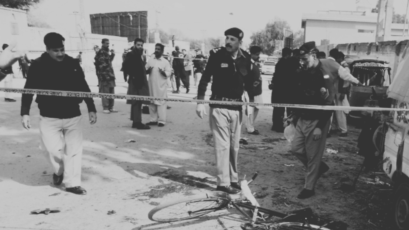 Security personnel secure the area following the terrorist attack on the Khazina Banda police check post in Hangu.