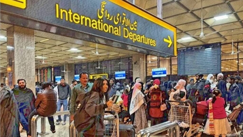FIA immigration officers conducting passenger screening at a Pakistani international airport.
