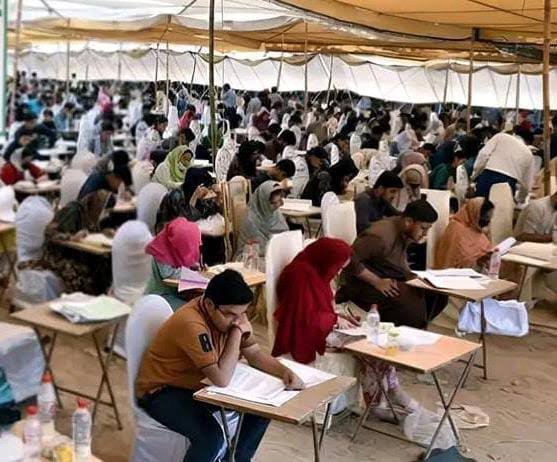 Students arriving at an MDCAT examination centre in Sindh for the 2026 medical college admission test.