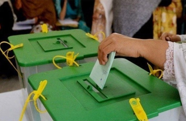Election staff prepare polling materials for AJK Legislative Assembly refugee constituency elections in Lahore.