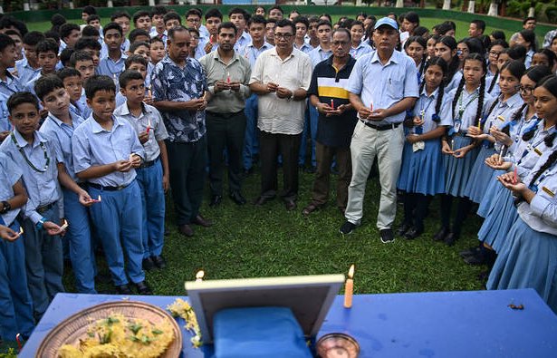 Students and teachers pay tribute to legendary mountaineer Nirmal Purja during a memorial ceremony at his former school in Chitwan, Nepal.