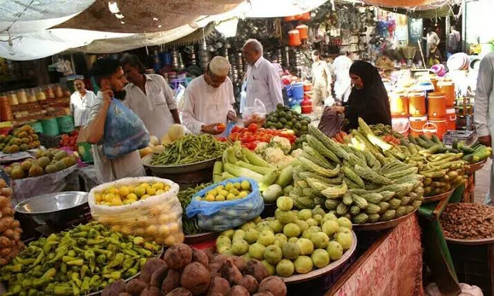 Onions and tomatoes displayed at a vegetable market in Pakistan amid rising food prices