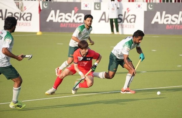 Pakistan hockey players celebrate after defeating South Korea to clinch the four-Test series in Islamabad.