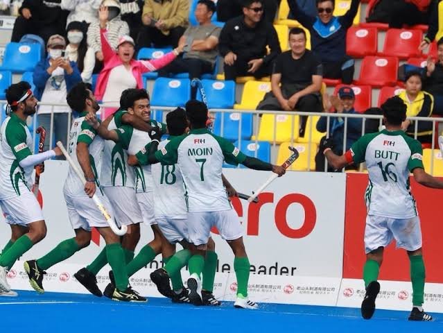 Pakistan hockey players celebrate after defeating South Korea 3-1 in the second Test match.