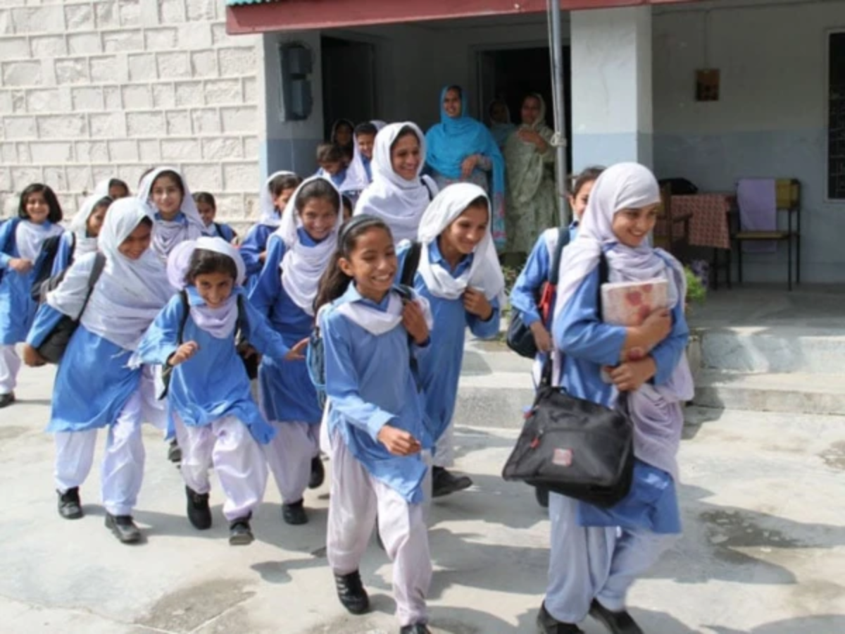Students return to a school in Punjab as educational institutions reopen after summer vacation.