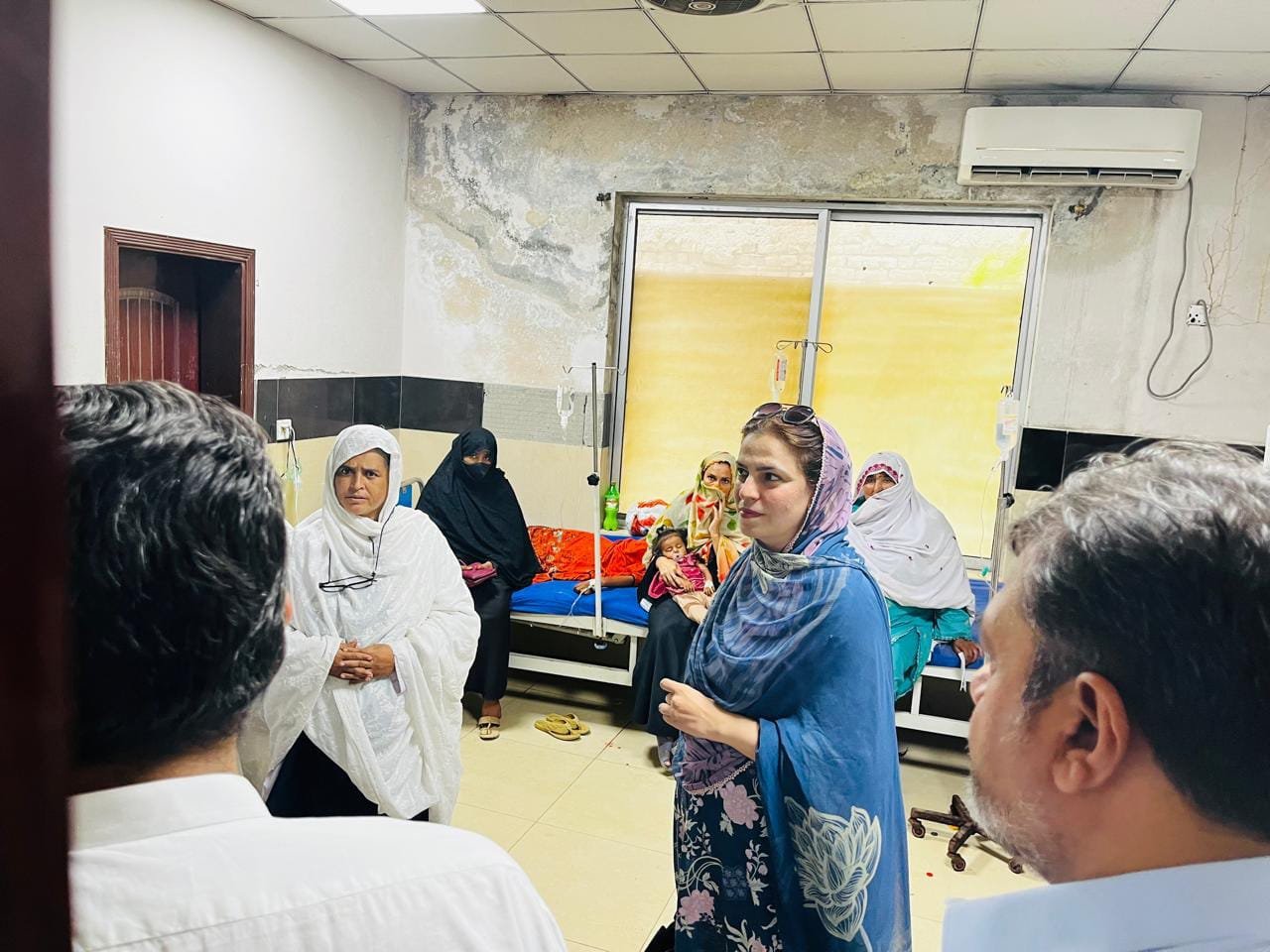 Assistant commissioner inspecting DHQ Hospital Nowshera during a review of hospital facilities and services
