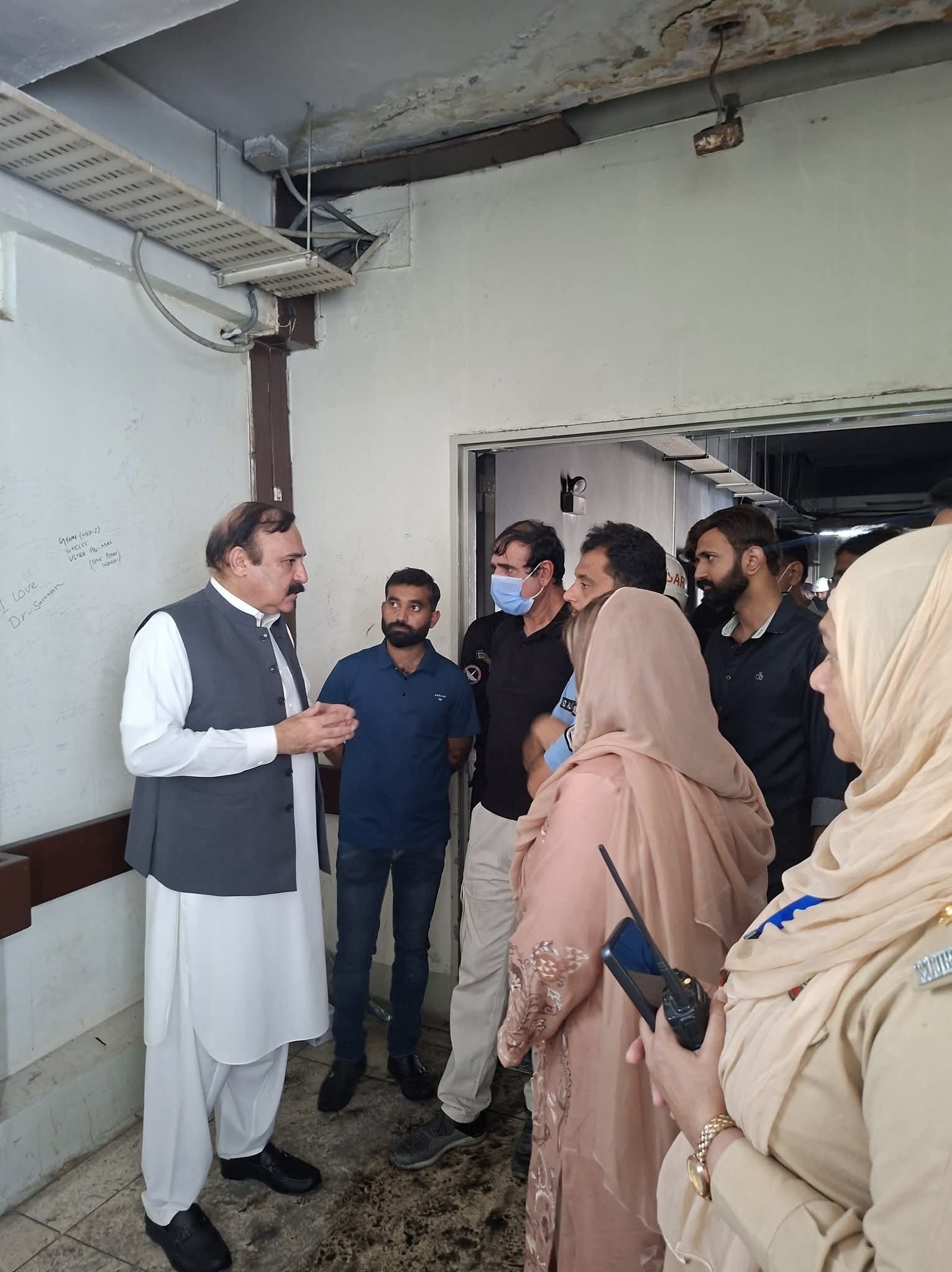 Firefighters and emergency teams outside PIMS after a blaze killed 14 newborns in Islamabad