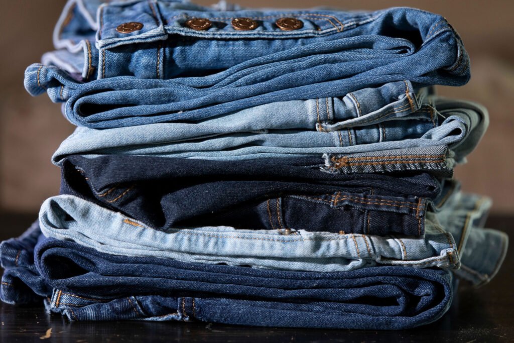 Blue denim jeans showing the traditional indigo color and faded texture associated with classic jeans.