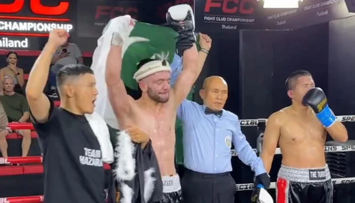 Pakistani boxer Usman Wazeer celebrates after winning his 19th international world-ranking fight in Thailand