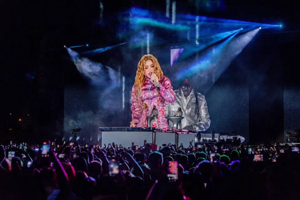 Shakira performs before a large crowd during the opening of her Madrid residency at Macondo Park.