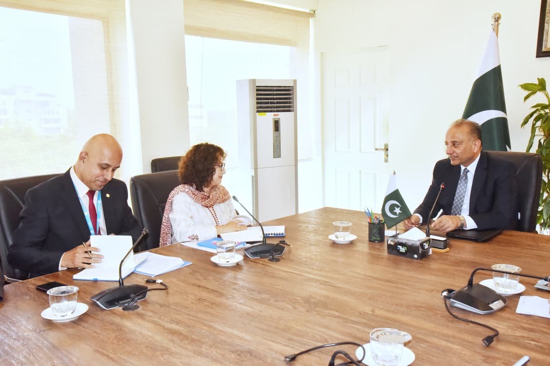 Federal Minister Muscad Malik meeting a UN-Habitat officer to discuss climate resilience and urban development in Pakistan