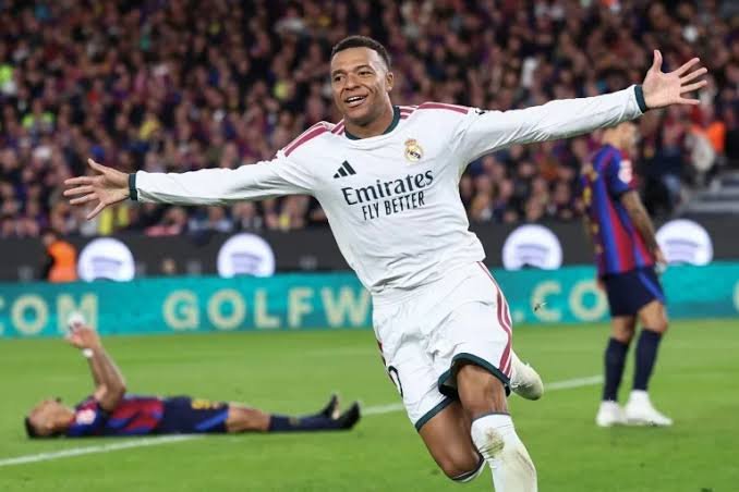 Mbappe Brace Fires Real Madrid to 2-1 El Clasico Win Over Barcelona Kylian Mbappe celebrates scoring for Real Madrid against Barcelona during the El Clasico match at Camp Nou.