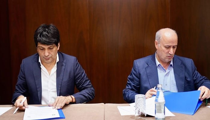 Pakistan Football Federation President Syed Mohsen Gilani and Iranian Football Federation President Mehdi Taj sign an agreement to promote football cooperation between Pakistan and Iran.