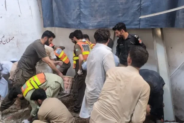 Rescue workers search through rubble after the roof of Al Khair School collapsed in Peshawar’s Afridi Abad area, killing 21 people and injuring 21 others.