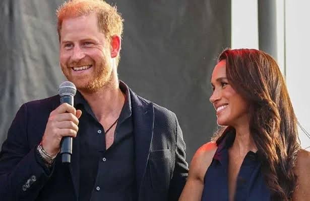 Prince Harry and Meghan Markle at a public appearance amid ongoing discussion about their relationship with the British Royal Family.